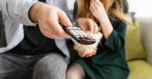 Man Holding Remote Control