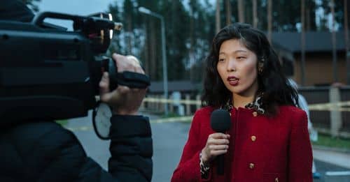 Woman in Red and Black Sweater Holding Black Camera