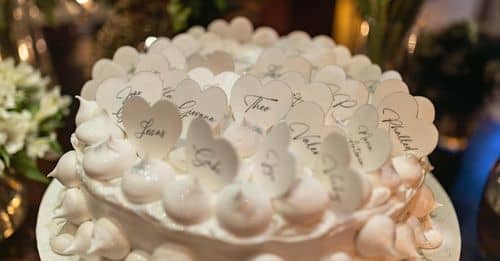 Wooden Hearts with Names Decorating Meringue Cake