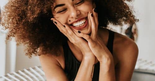 Woman Sitting And Smiling