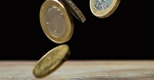 Coins on Brown Wood