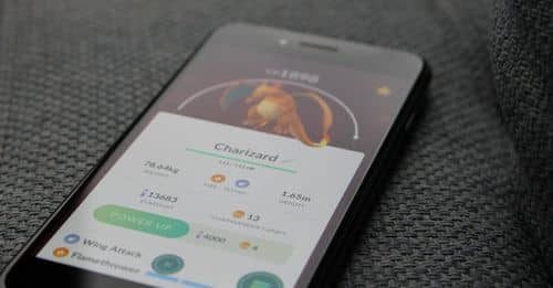 Turned-on Iphone Displaying Pokemon Go Charizard Application