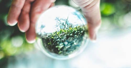 Close-Up Photo of Person Holding Lensball