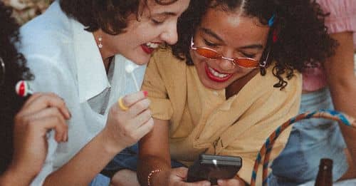 Shallow Focus Photo of Woman Using Game boy