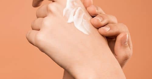 Person Applying Hand Cream