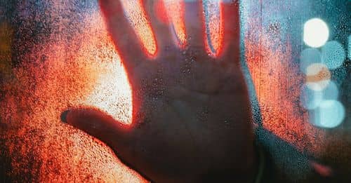 Hand Touching Glass