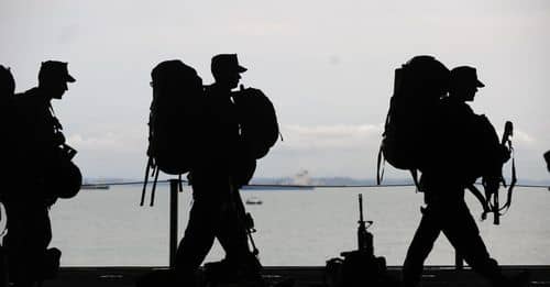 Silhouette of Soldiers Walking