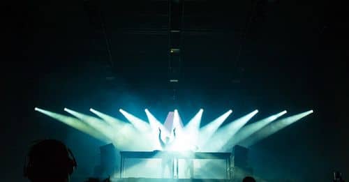 People Inside Dark Room With Spotlights