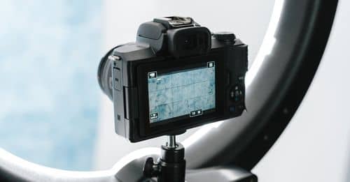 Contemporary professional photo camera prepared for shooting