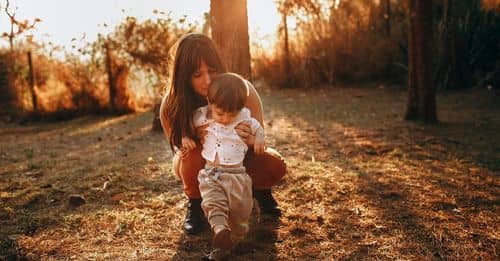 Woman with son walking in park