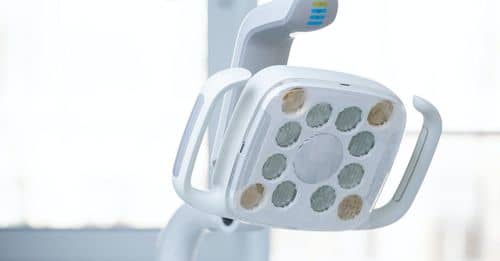 Electric light bulbs of dental lamp included in dentist workplace equipment set in stomatology