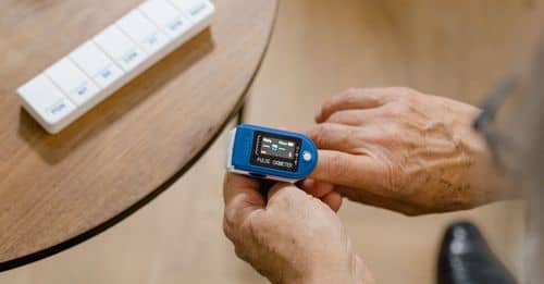 An Elderly Person Checking His Blood Oxygen Level