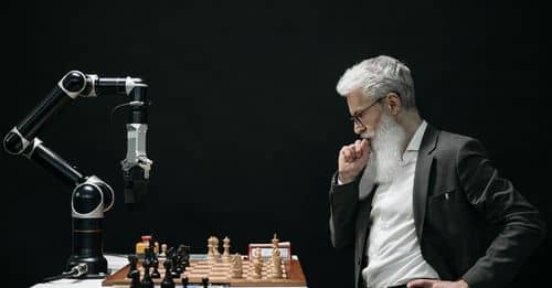 Elderly Man Thinking while Looking at a Chessboard