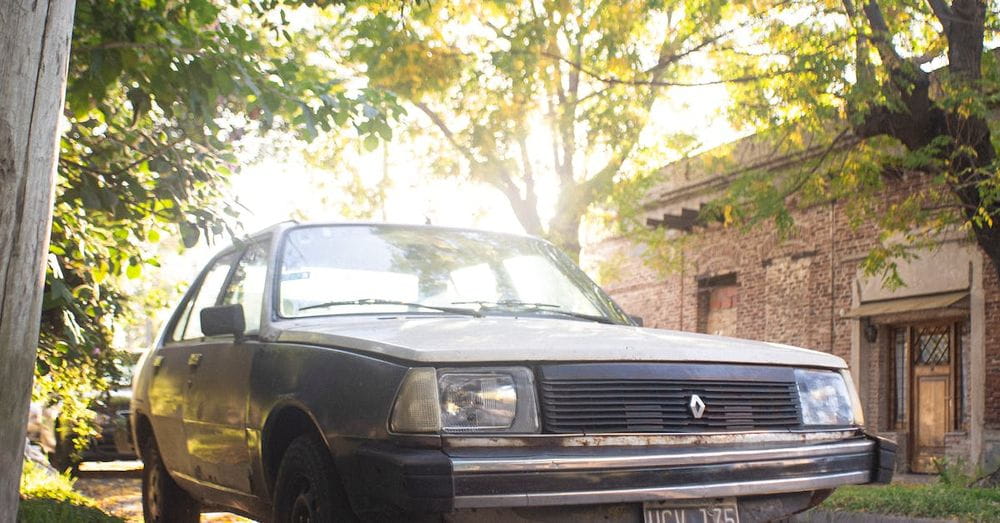 A Renault 18 Parked by a Curb