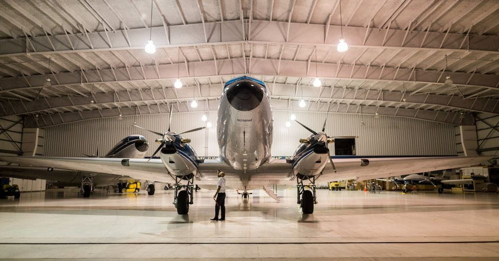 Gray Plane Inside Hangar