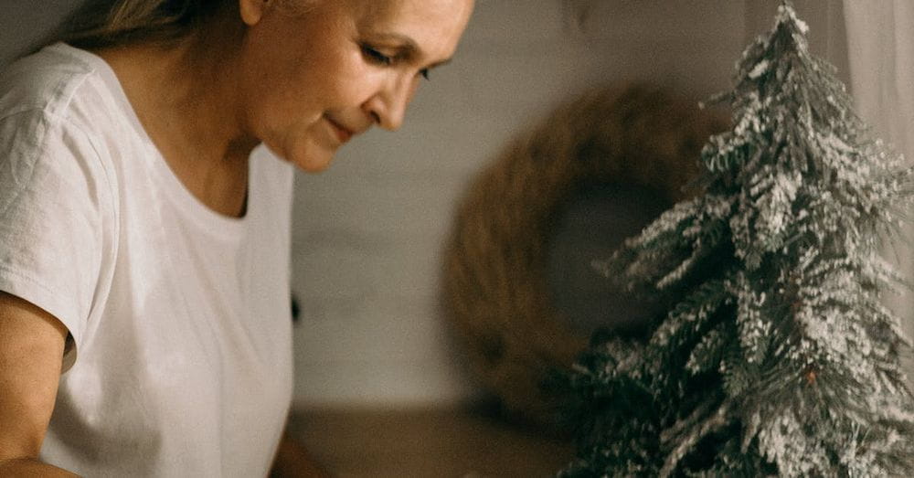 Selective Focus Photography of Standing Woman in Front of Dish