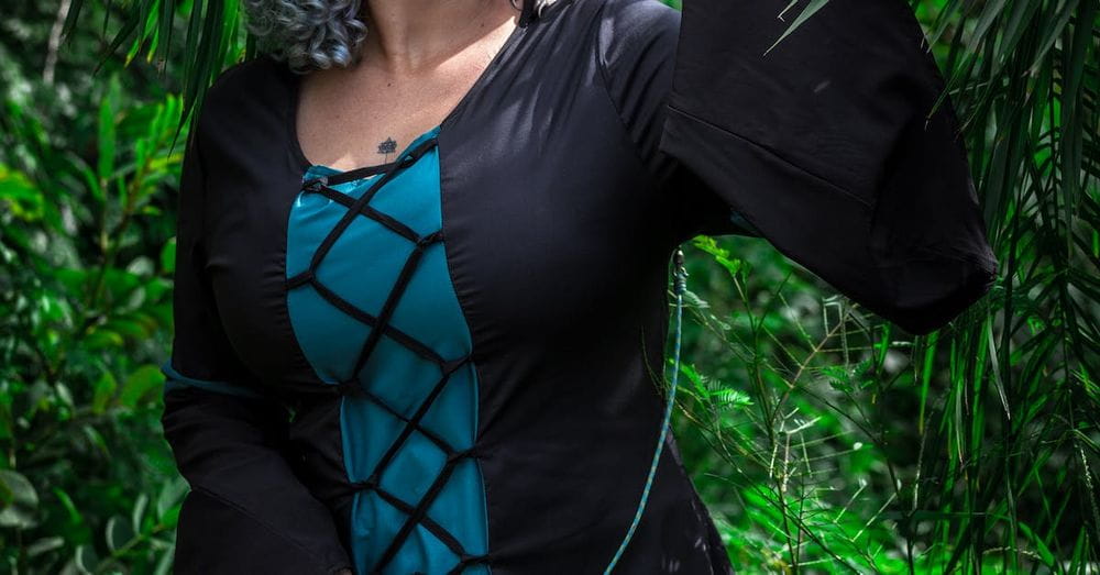 Woman Standing With Barn Owl on Her Shoulder