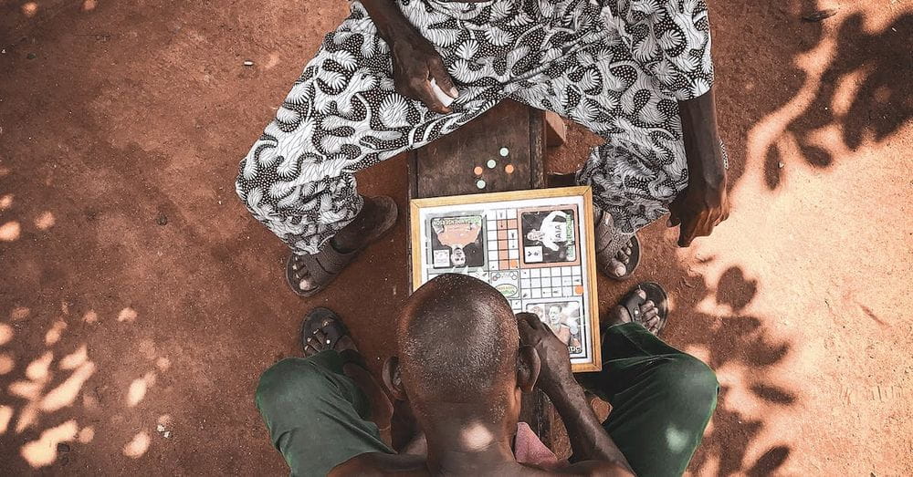 Top View Photo Of Men Playing Board Game