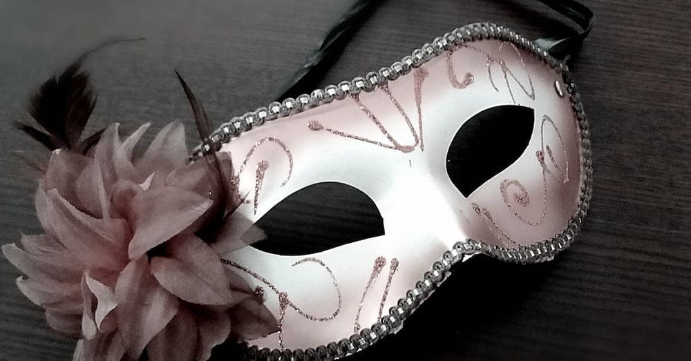 Carnival mask decorated with pink flower