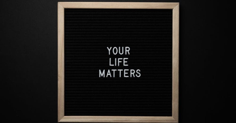 Blackboard with YOUR LIFE MATTERS inscription on black background