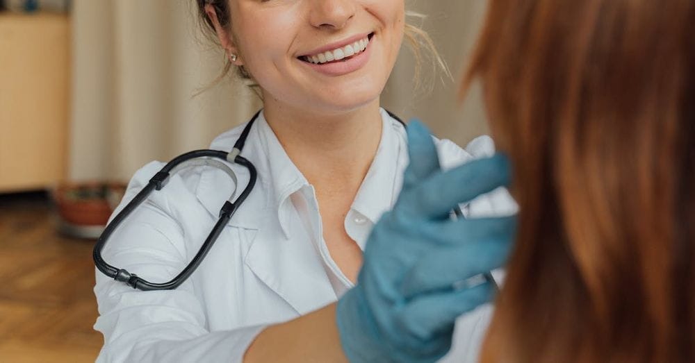 A Woman in White Long Sleeve Shirt Smiling