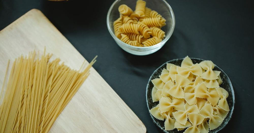 Different types of Italian pasta on table