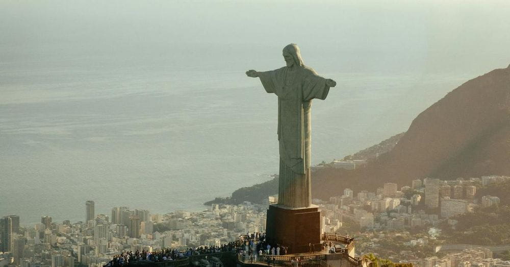 Statue of Jesus Christ on mount in evening