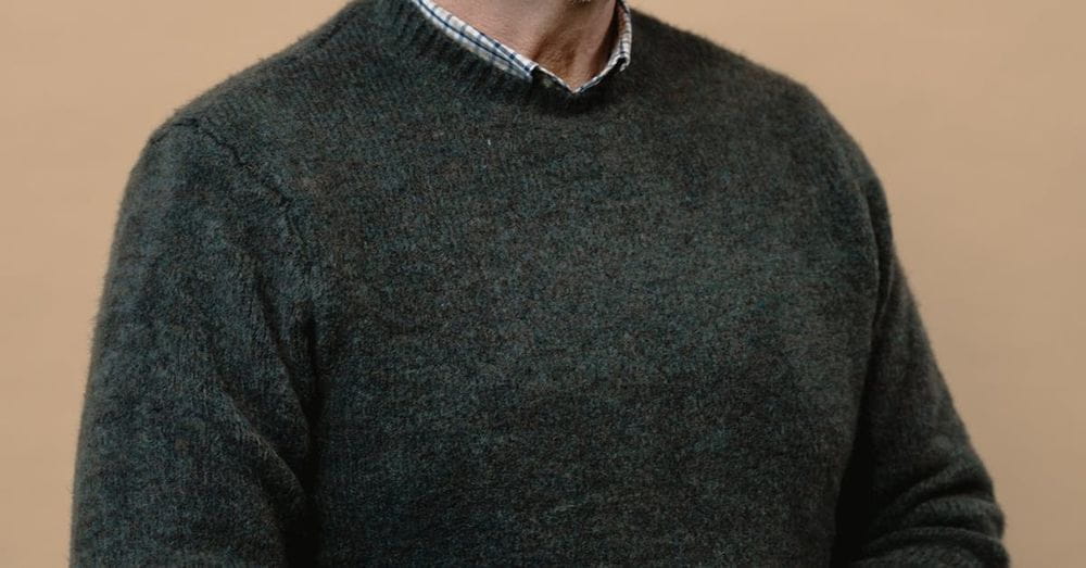 An Elderly Man in Gray Sweater Wearing Sunglasses