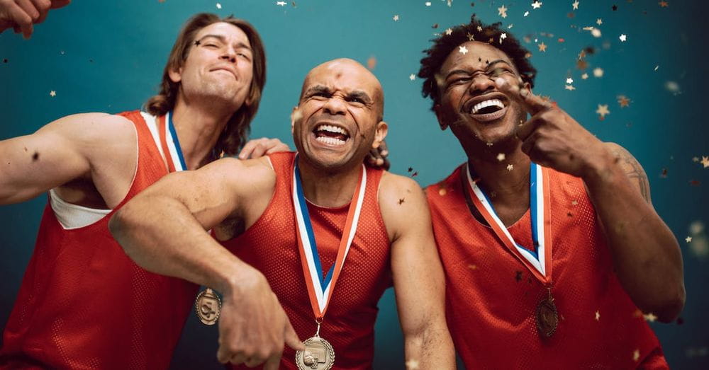 Confetti Falling on Proud Basketball Players Wearing Medals